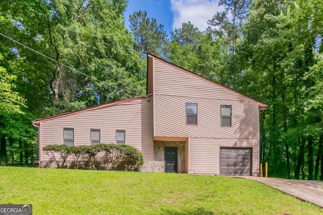 3851 Natalie Way, Ellenwood, GA 30294 - mid-century home with a front yard, driveway, and an attached garage