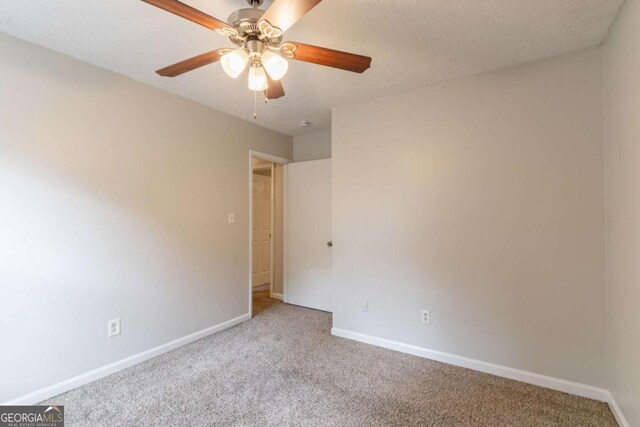 3851 Natalie Way, Ellenwood, GA 30294 - carpeted empty room featuring baseboards and ceiling fan