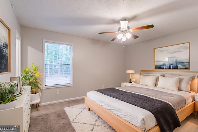 3851 Natalie Way, Ellenwood, GA 30294 - bedroom with light colored carpet and ceiling fan