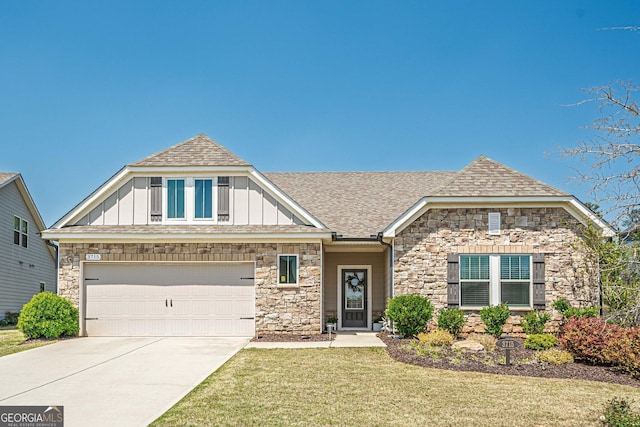 3715 Bridges Ct, Cumming, GA 30040 - view of front facade featuring board and batten siding, stone siding, concrete driveway, and a front lawn