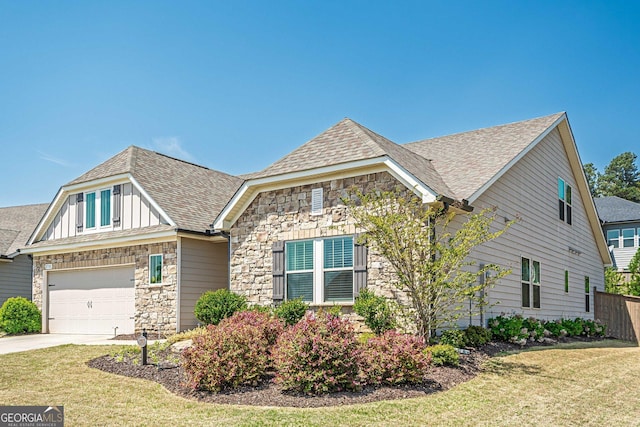 3715 Bridges Ct, Cumming, GA 30040 - view of front of home featuring stone siding, roof with shingles, concrete driveway, and board and batten siding