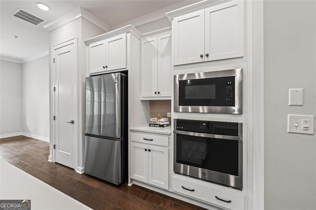 240 Walker Ave, Roswell, GA 30076 - kitchen featuring stainless steel appliances, crown molding, decorative backsplash, light countertops, and white cabinets
