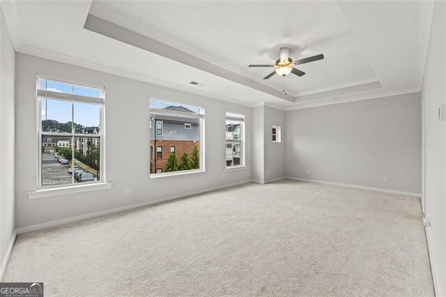 240 Walker Ave, Roswell, GA 30076 - unfurnished room featuring a tray ceiling, ceiling fan, carpet, and crown molding
