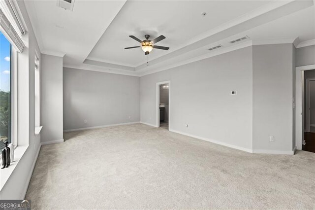 240 Walker Ave, Roswell, GA 30076 - spare room with light colored carpet, ceiling fan, crown molding, and a raised ceiling