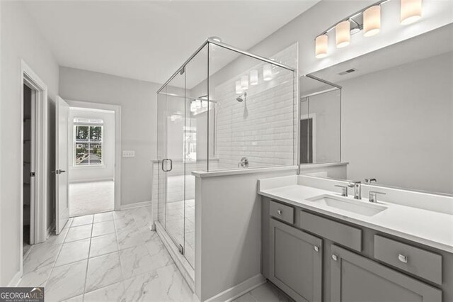 240 Walker Ave, Roswell, GA 30076 - bathroom featuring marble look tile flooring, vanity, and a stall shower