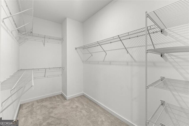 240 Walker Ave, Roswell, GA 30076 - walk in closet featuring carpet flooring