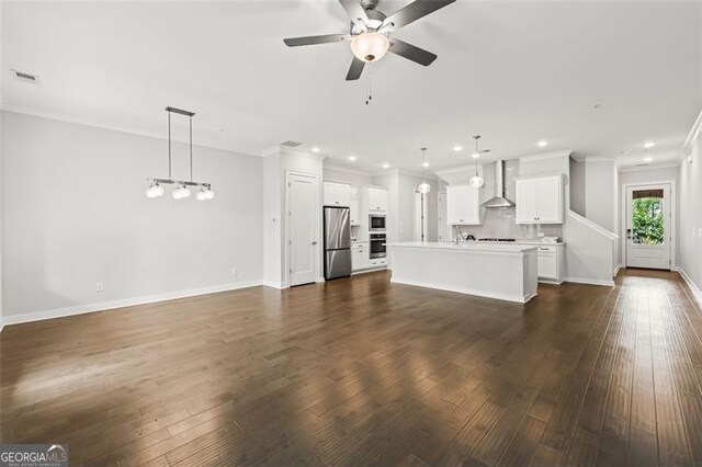 240 Walker Ave, Roswell, GA 30076 - unfurnished living room featuring crown molding, ceiling fan, dark wood-style floors, and recessed lighting