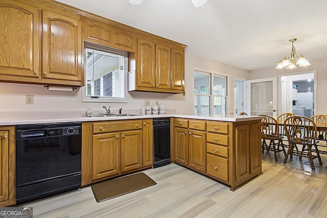 118 Hidden Hills Dr, Macon, GA 31217 - kitchen featuring dishwasher, a sink, a peninsula, and light wood finished floors