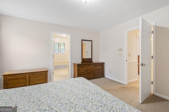 118 Hidden Hills Dr, Macon, GA 31217 - bedroom featuring light colored carpet, baseboards, a textured ceiling, and ensuite bath