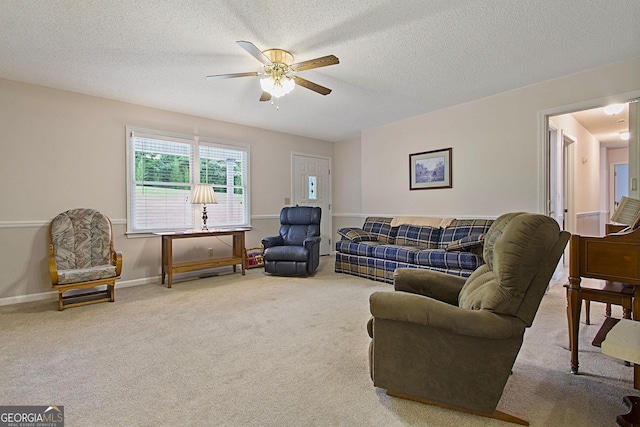 118 Hidden Hills Dr, Macon, GA 31217 - carpeted living area with ceiling fan, a textured ceiling, and baseboards
