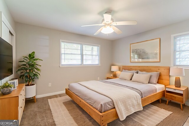 4078 Bouldercrest Rd, Ellenwood, GA 30294 - bedroom with light colored carpet and a ceiling fan