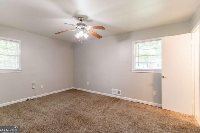 4078 Bouldercrest Rd, Ellenwood, GA 30294 - carpeted spare room featuring a ceiling fan and baseboards