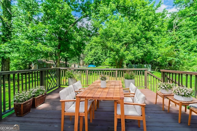 4078 Bouldercrest Rd, Ellenwood, GA 30294 - deck with outdoor dining space and a lawn