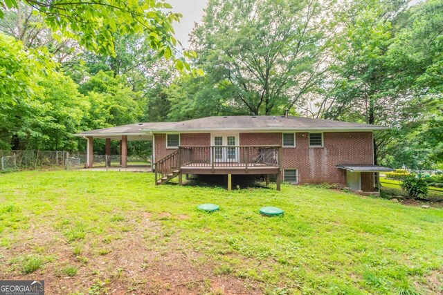 4078 Bouldercrest Rd, Ellenwood, GA 30294 - back of property with a wooden deck and brick siding