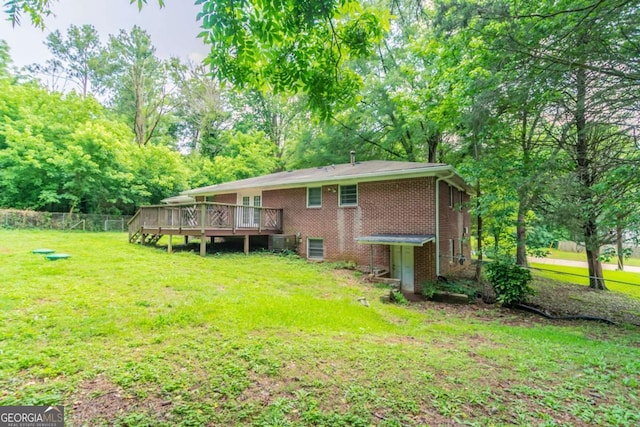 4078 Bouldercrest Rd, Ellenwood, GA 30294 - back of house with a wooden deck and brick siding