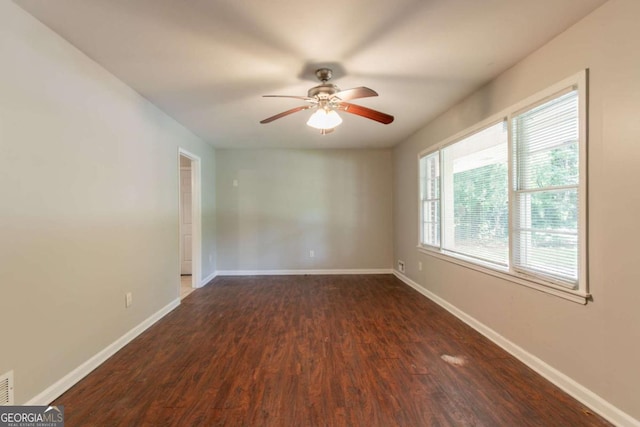 4078 Bouldercrest Rd, Ellenwood, GA 30294 - spare room with ceiling fan and dark wood-style floors