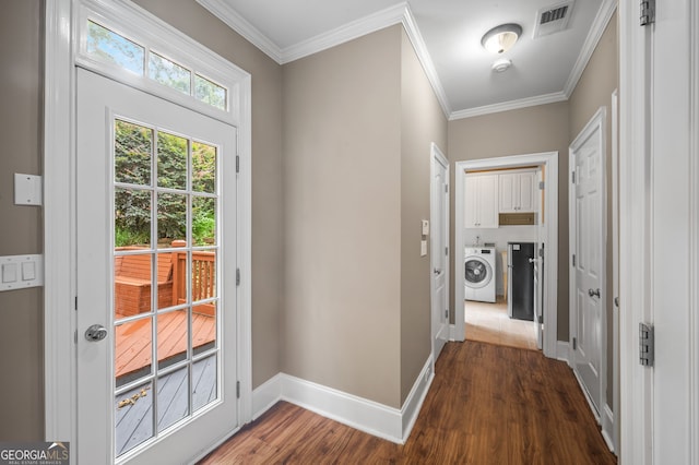 3725 Paces Park Cir SE, Smyrna, GA 30080 - doorway to outside featuring washer / dryer, dark wood-style floors, baseboards, and ornamental molding