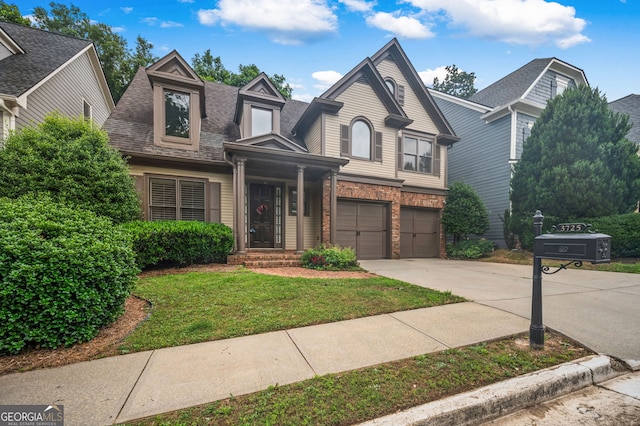 3725 Paces Park Cir SE, Smyrna, GA 30080 - view of front facade with driveway, roof with shingles, a front yard, an attached garage, and brick siding