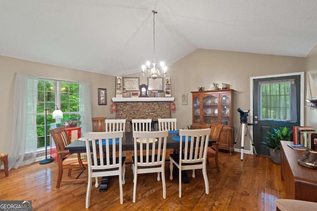 345 Jesse Martin Trl, Canton, GA 30115 - dining space featuring a chandelier, wood-type flooring, and vaulted ceiling