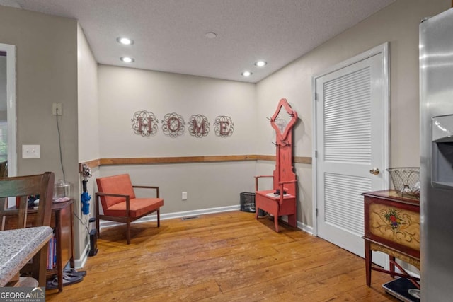 345 Jesse Martin Trl, Canton, GA 30115 - living area with wood-type flooring, recessed lighting, a textured ceiling, and baseboards