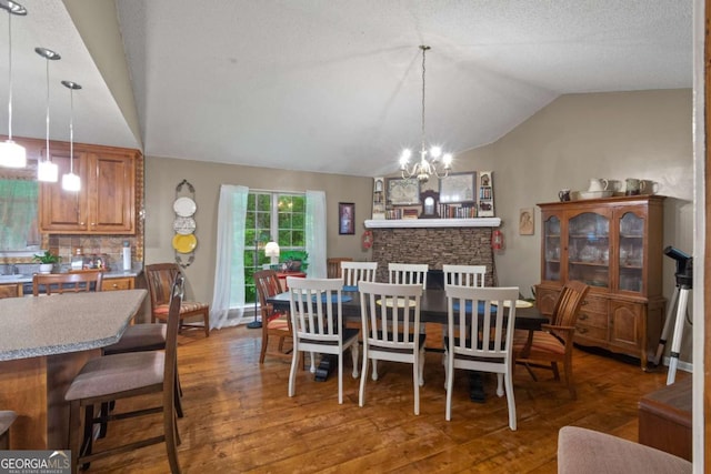 345 Jesse Martin Trl, Canton, GA 30115 - dining room featuring lofted ceiling, a chandelier, and wood finished floors