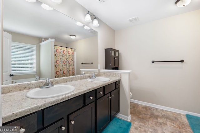 149 Pristine Dr, Locust Grove, GA 30248 - full bath with double vanity and stone finish flooring