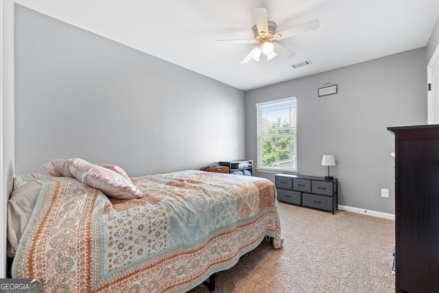 149 Pristine Dr, Locust Grove, GA 30248 - carpeted bedroom featuring a ceiling fan and baseboards