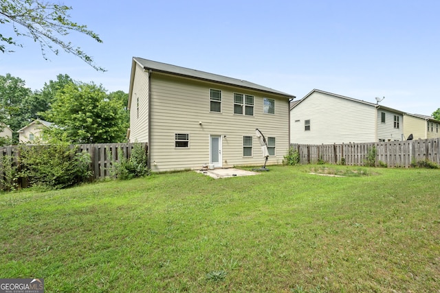 149 Pristine Dr, Locust Grove, GA 30248 - rear view of house with a fenced backyard