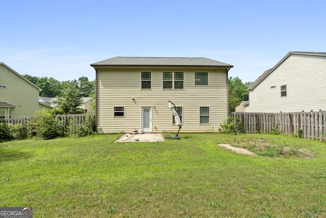 149 Pristine Dr, Locust Grove, GA 30248 - rear view of property with a fenced backyard and a patio