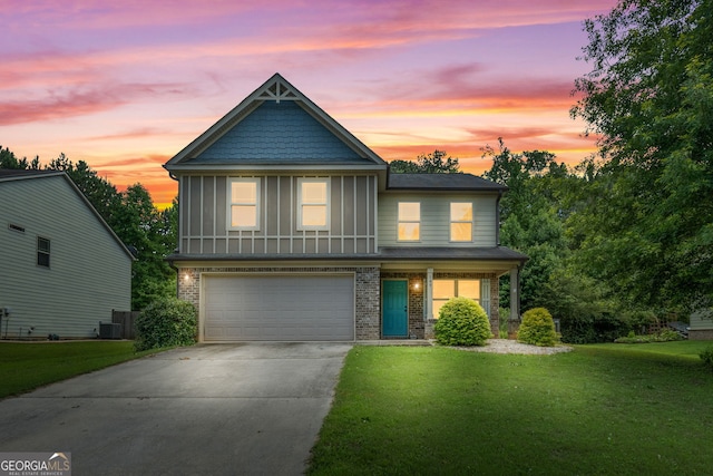149 Pristine Dr, Locust Grove, GA 30248 - view of front of house featuring concrete driveway, an attached garage, a front lawn, and brick siding