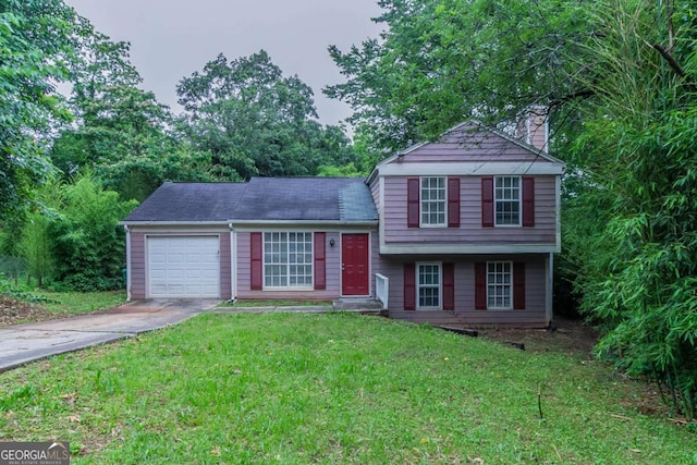 4634 Garden Hills Dr, Stone Mountain, GA 30083 - tri-level home with an attached garage, concrete driveway, a chimney, and a front lawn