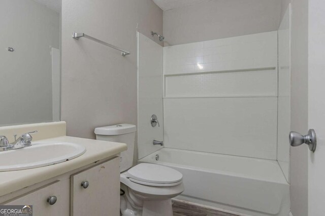 4634 Garden Hills Dr, Stone Mountain, GA 30083 - full bath with vanity, tub / shower combination, and wood finished floors
