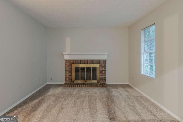 4634 Garden Hills Dr, Stone Mountain, GA 30083 - unfurnished living room featuring carpet and a fireplace