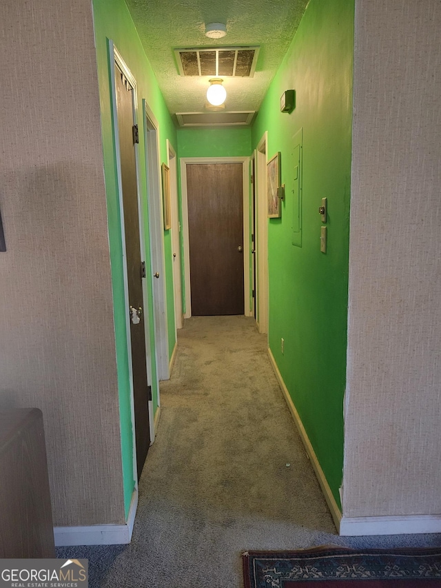 106 Garden Trl, Stockbridge, GA 30281 - corridor with baseboards, carpet floors, and a textured ceiling