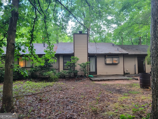 106 Garden Trl, Stockbridge, GA 30281 - rear view of house with a patio and a chimney