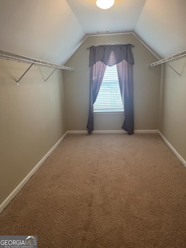 901 Broderick Cir, Warner Robins, GA 31088 - spacious closet featuring vaulted ceiling and light colored carpet