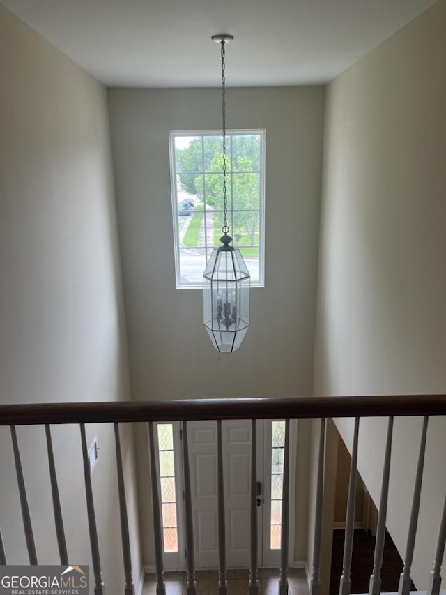 901 Broderick Cir, Warner Robins, GA 31088 - staircase featuring a chandelier