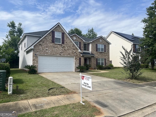 901 Broderick Cir, Warner Robins, GA 31088 - traditional home featuring driveway, a front lawn, brick siding, and an attached garage