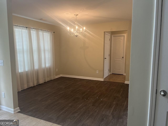 901 Broderick Cir, Warner Robins, GA 31088 - spare room with a chandelier, baseboards, and wood finished floors