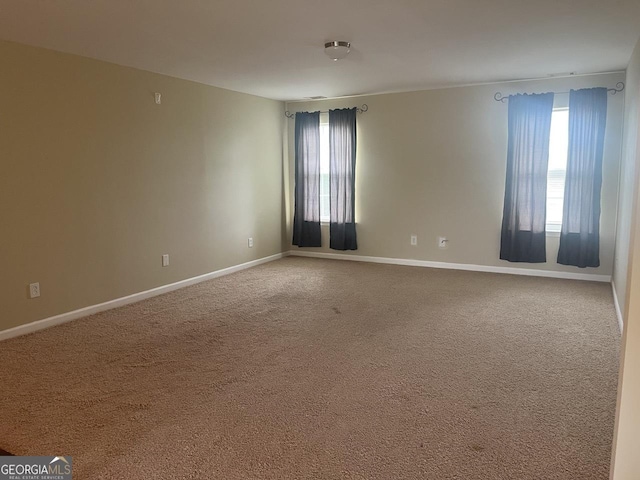 901 Broderick Cir, Warner Robins, GA 31088 - spare room featuring healthy amount of natural light, carpet flooring, and baseboards