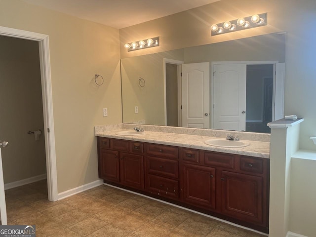 901 Broderick Cir, Warner Robins, GA 31088 - bathroom featuring double vanity and baseboards
