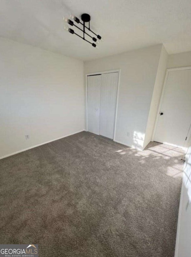 4701 Flat Shoals Rd Unit 48B, Union City, GA 30291 - unfurnished bedroom with carpet and a closet
