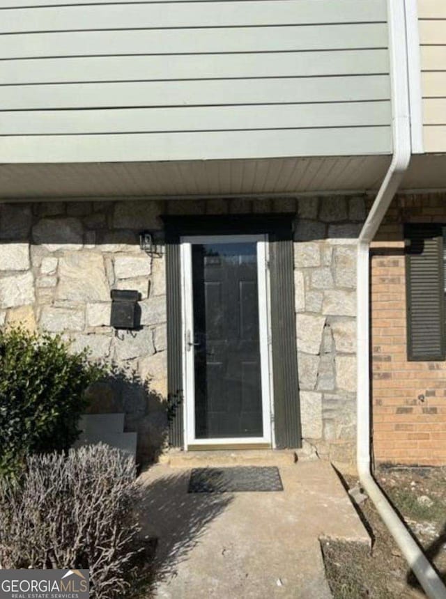 4701 Flat Shoals Rd Unit 48B, Union City, GA 30291 - doorway to property featuring stone siding