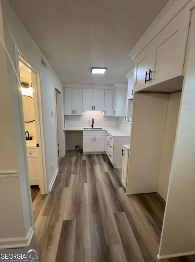 4701 Flat Shoals Rd Unit 48B, Union City, GA 30291 - laundry area with dark wood-style floors and a sink
