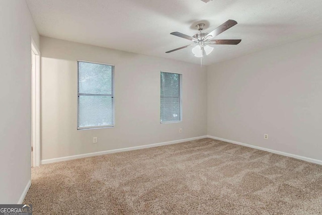 4905 Sandberg Ct, Stone Mountain, GA 30088 - carpeted empty room with baseboards and ceiling fan