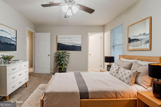 4905 Sandberg Ct, Stone Mountain, GA 30088 - bedroom with light colored carpet, a ceiling fan, and baseboards