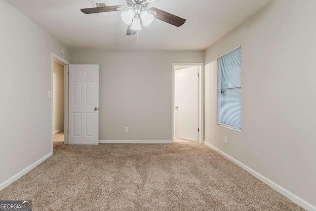4905 Sandberg Ct, Stone Mountain, GA 30088 - unfurnished bedroom with carpet, baseboards, and ceiling fan