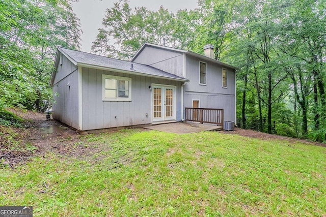 4905 Sandberg Ct, Stone Mountain, GA 30088 - rear view of house featuring french doors, a chimney, and a lawn
