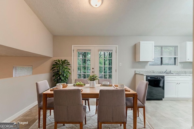 4905 Sandberg Ct, Stone Mountain, GA 30088 - dining area featuring french doors, a textured ceiling, and baseboards