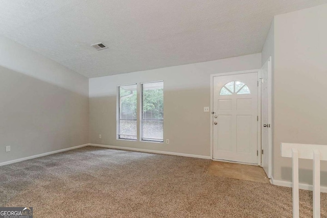 4905 Sandberg Ct, Stone Mountain, GA 30088 - carpeted entrance foyer featuring baseboards and a textured ceiling